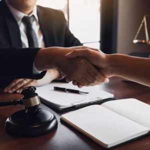 Lawyer in Colorado shaking hands with a domestic violence client